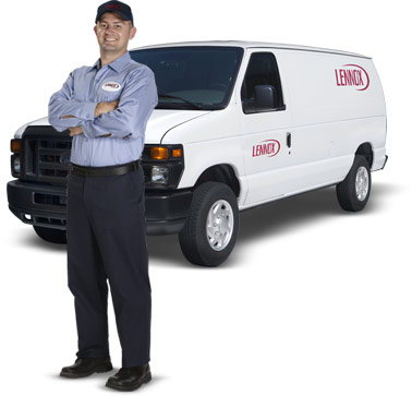 Furnace and air conditioner repair technician with the van on the background. The van has a Lennox logo on it